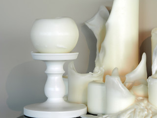 Fototapeta na wymiar white candles with melted wax