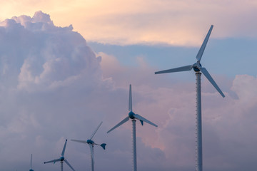 Obraz premium Wind turbine power generator at twilight