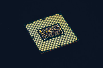 Electronic collection - CPU from the bottom side isolated on black background.