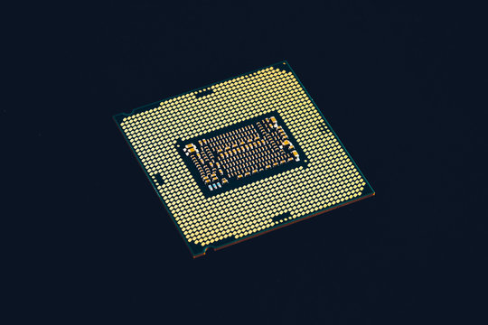 Electronic collection - CPU from the bottom side isolated on black background.