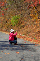 Female tourists  taking photo in GuanMenShan scenic spot, China
