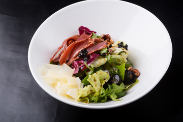 Elegant duck meat salad with caviar