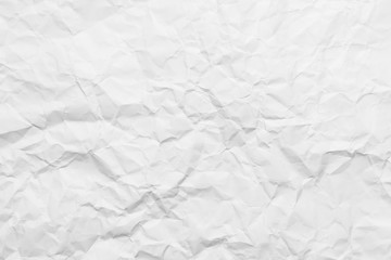 Background of a crumpled white sheet of a paper.