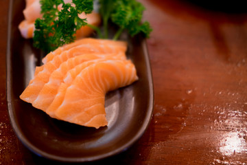 Raw salmons fillet on dish in restaurant