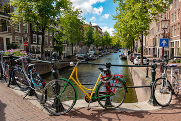 Colourful bicycle next to the canal in Amsterdam