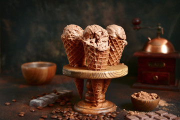 Chocolate coffee ice cream in a waffle cone.