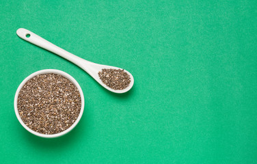Chia seeds - Salvia hispánica. Green background