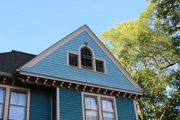 Brightly colored new England historic Victorian house