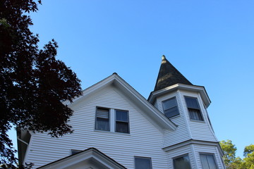 Brightly colored new England historic Victorian house