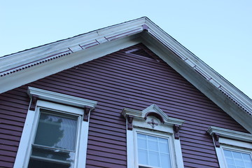 Brightly colored new England historic Victorian house