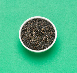 Black organic seeds of sesame - Sesamum indicum.
