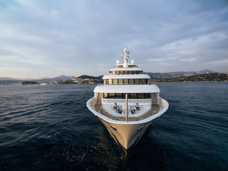  stunning bow view of white motor yacht