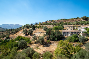 Fototapeta na wymiar landscape with a view abandoned buildings on Crete