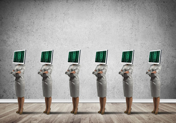 Business women with monitors instead of head.