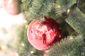 Decorated Christmas tree on blurred, sparkling and fairy background.