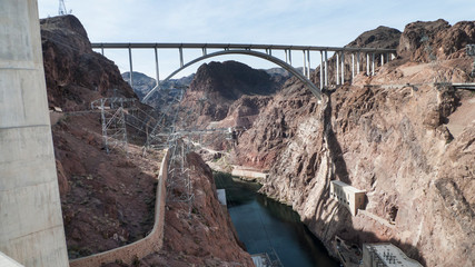 Hoover Dam bridge over the Colorado River with power lines