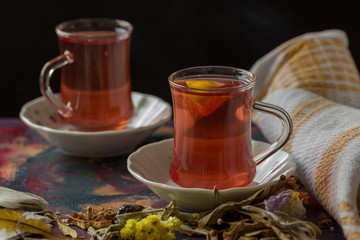 herbal teas in glass cups on wooden table