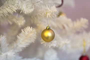 Christmas background - baubles and branch of white spruce tree