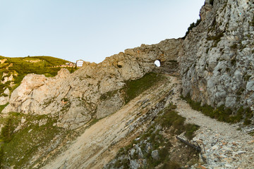 A gate through the rock and sunrise