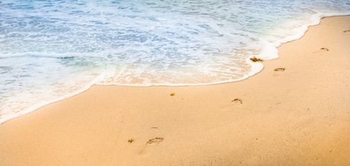 Bare feet in the sand.