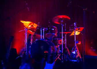 Concert stage with musical instruments.
