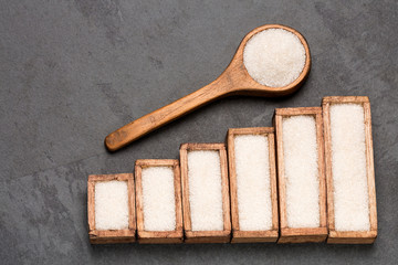 Refined white sugar powder and cubes. Statistical table of sale and consumption. Top view