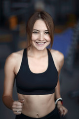 Fototapeta na wymiar close up.portrait of an attractive woman in the gym