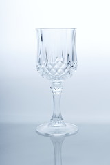 empty wine glass on blue background