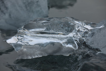 Chunks of glacier ice floating in the water. Diamond Beach, Iceland