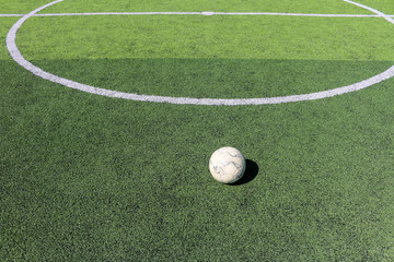 Football on artificial turf. It is for green background in a stadium