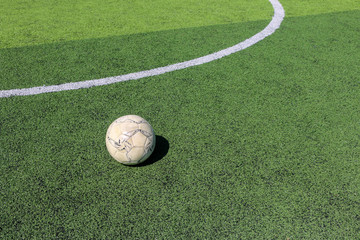 Football on artificial turf. It is for green background in a stadium