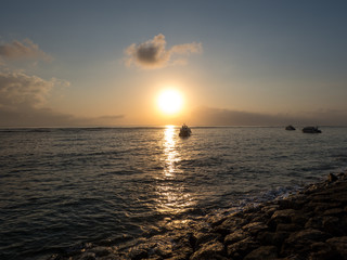 Boats in amazing sunrise scenery at Karang Beach, Sanur, Bali, Indonesia. October, 2018