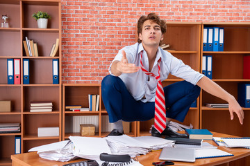 Unhappy businessman sitting in the office 