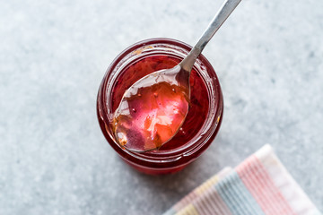 Homemade Jam of Rose Petals in Jar with Spoon / Marmalade.
