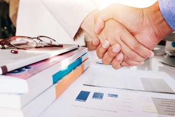 Close up of Business people shaking hands, finishing up meeting, business etiquette,...