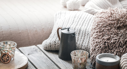 still life from home interior on a wooden background with a candle