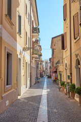 Fototapeta na wymiar Shopping downtown in city of Bardolino at Lake Garda in Italy 