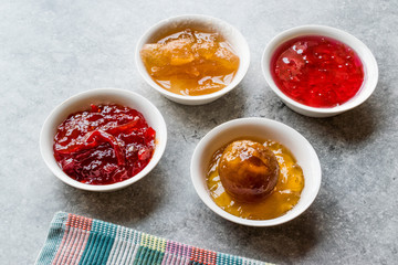 Assorted Variety of Jams and Marmalades;  Rose, Red Pepper, Mandarin and Citron Peel in Small Bowl.