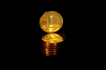 Gold coins crypto curency litecoin black background