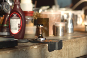 tamper and piston/portafilter machine making espresso coffee