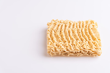 Dry uncooked instant noodles isolated in white background, top view, copy space, soft light
