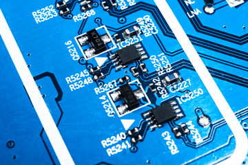 Macro shot of a Circuitboard with resistors microchips and electronic components. Computer hardware...