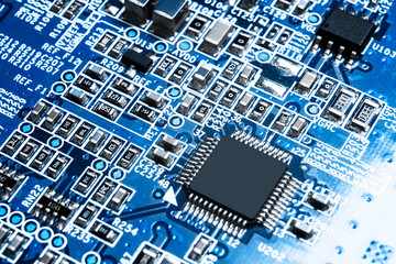 Macro shot of a Circuitboard with resistors microchips and electronic components. Computer hardware...