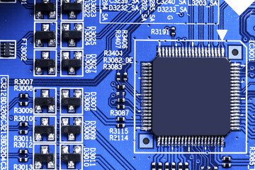 Macro shot of a Circuitboard with resistors microchips and electronic components. Computer hardware...