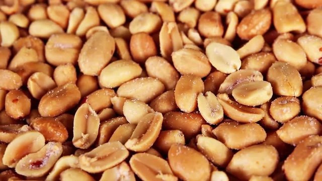Peanut peanuts texture closeup on rotating plate