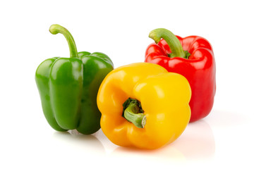 Three different colored of sweet bell peppers (capsicum) isolated on white background..