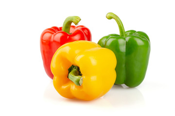 Three different colored of sweet bell peppers (capsicum) isolated on white background.