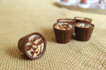 Chocolate-shaped candy with coconut filling