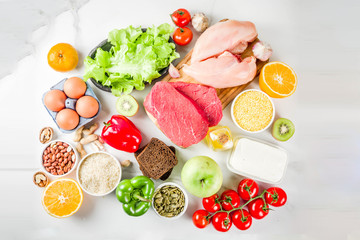 Healthy diet food. Various low fodmap ingredients selection - meat, vegetables, berry, fruit, grains, Trendy healthy lifestyle concept. On white marble background copy space top view