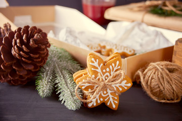 Christmas cookies snowflakes and gifts box on the wooden table